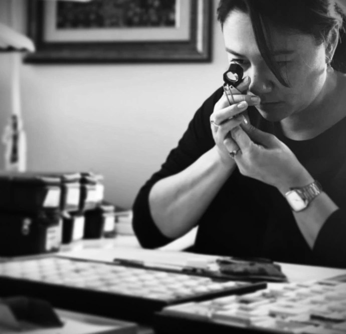 A gemmologist examining gems